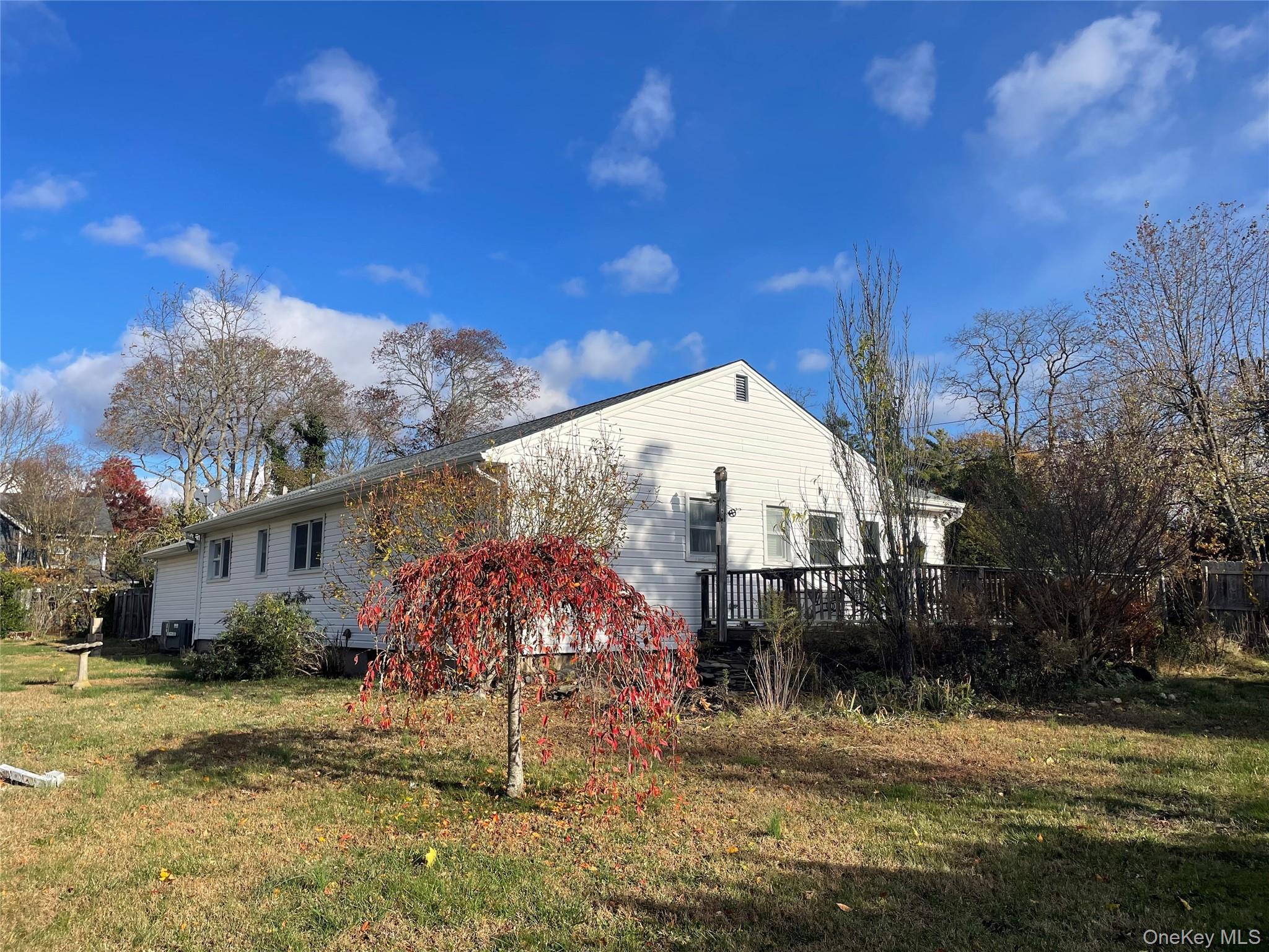 8 Atlantic Avenue Blue Point, NY 11715 - Photo 2 of 24 a view of a house with a yard