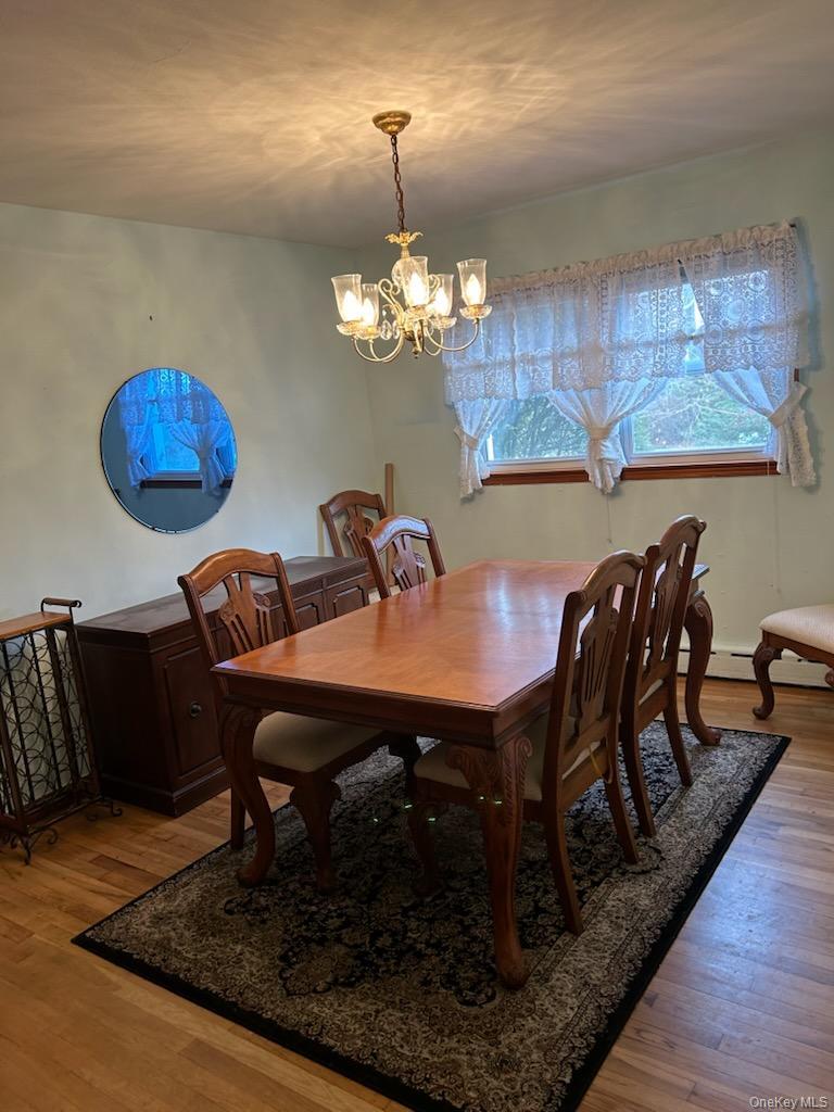 8 Atlantic Avenue Blue Point, NY 11715 - Photo 6 of 24 a view of a dining room with furniture