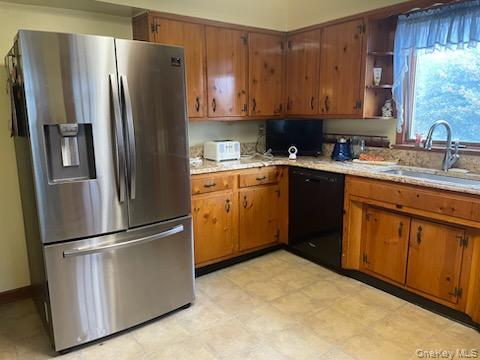 8 Atlantic Avenue Blue Point, NY 11715 - Photo 9 of 24 a kitchen with stainless steel appliances granite countertop a refrigerator sink and cabinets