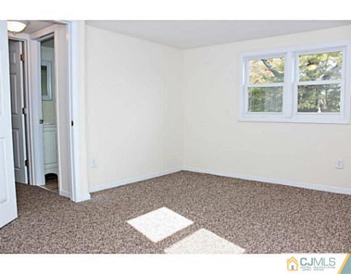 202 Jackson Avenue Edison, NJ 08837 - Photo 14 of 17 an empty room with windows