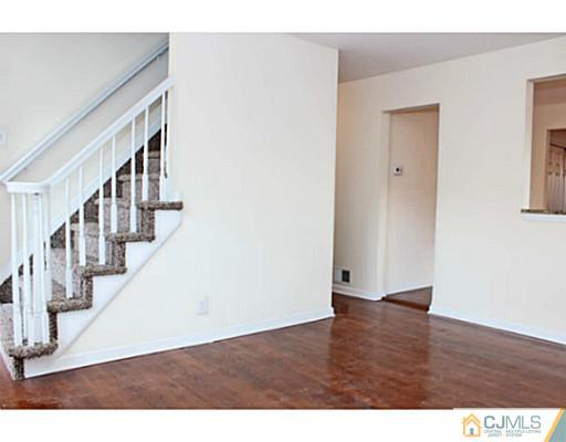 202 Jackson Avenue Edison, NJ 08837 - Photo 9 of 17 a view of an entryway with wooden floor