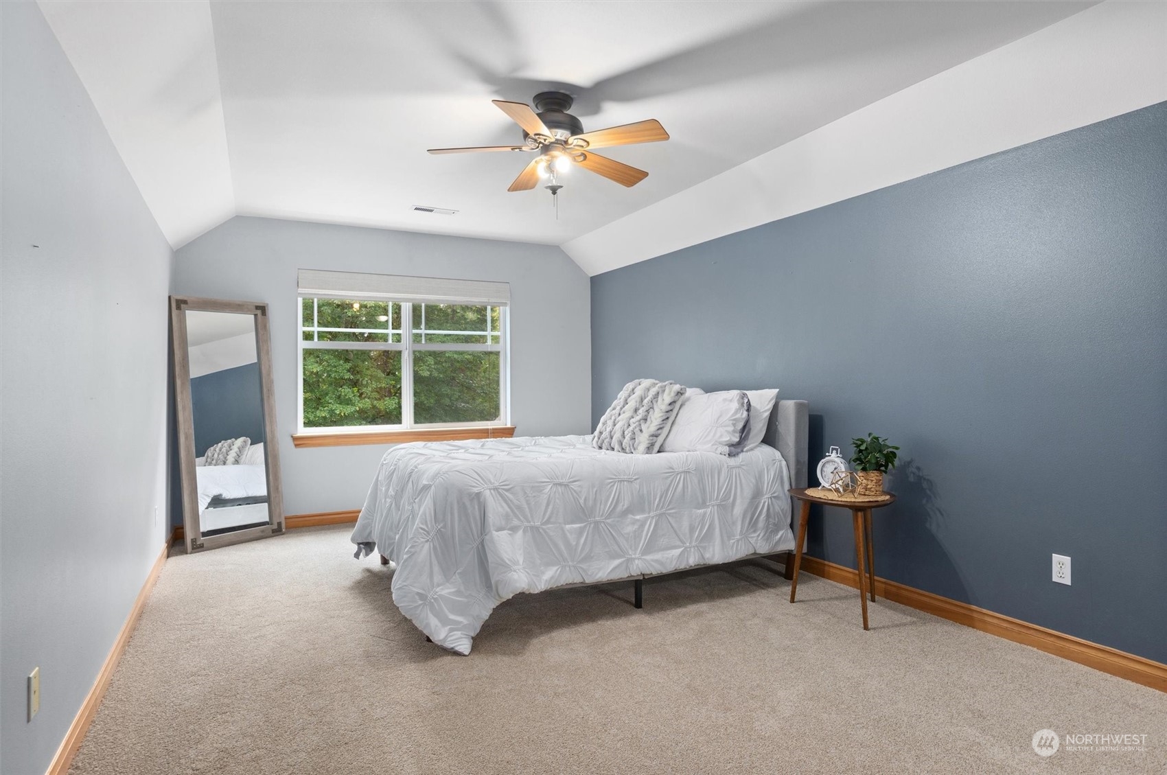 18606 Rainier View Road Southeast Monroe, WA 98272 - Photo 21 of 40 a bed room with a bed and a chandelier
