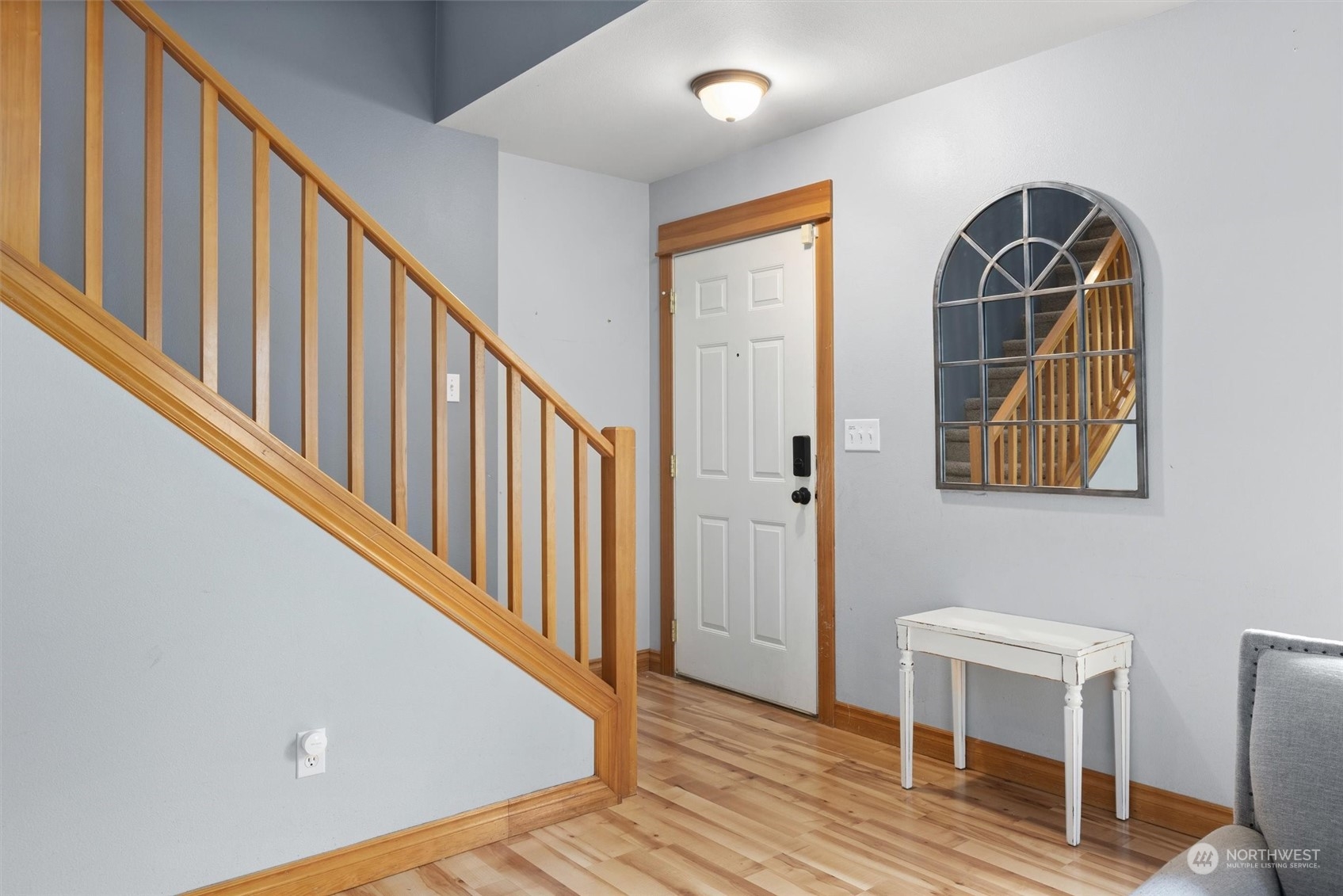 18606 Rainier View Road Southeast Monroe, WA 98272 - Photo 4 of 40 a view of a hallway with wooden floor and entryway