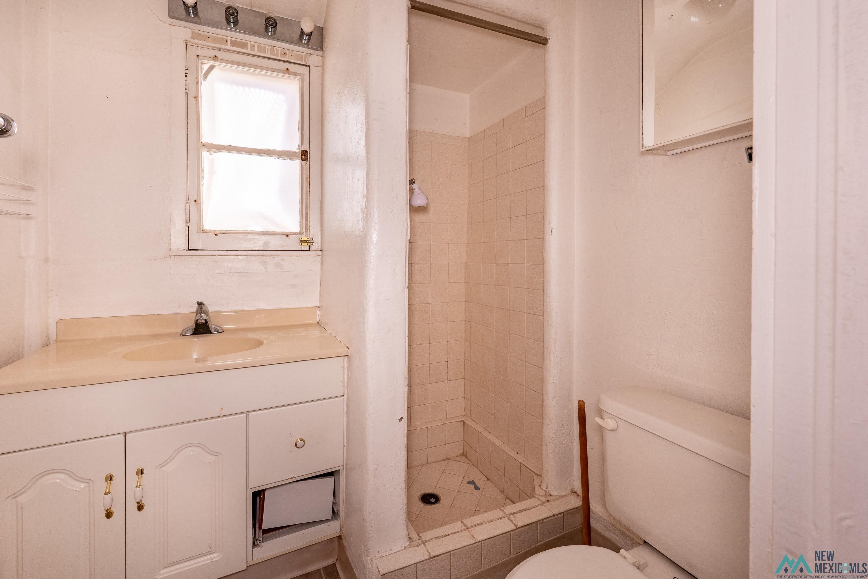 301 South 4th Street Raton, NM 87740 - Photo 68 of 78 Bathroom featuring a shower stall and vanity