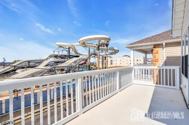 a view of a balcony with chairs