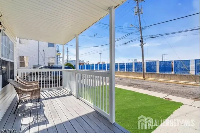 a view of a balcony with wooden floor