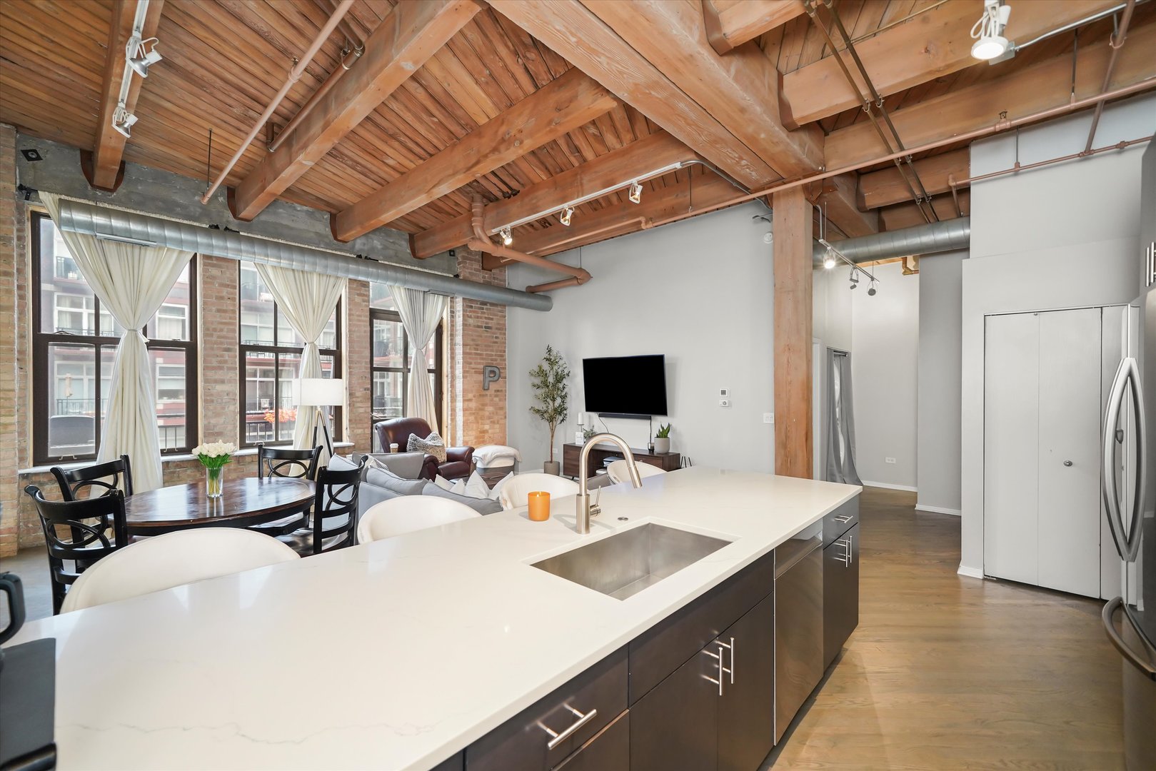 Undisclosed Address Chicago, IL 60607 - Photo 11 of 34 a large white kitchen with a large window