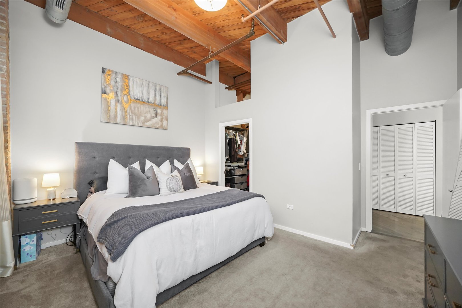 Undisclosed Address Chicago, IL 60607 - Photo 13 of 34 a bedroom with a bed and wall painting