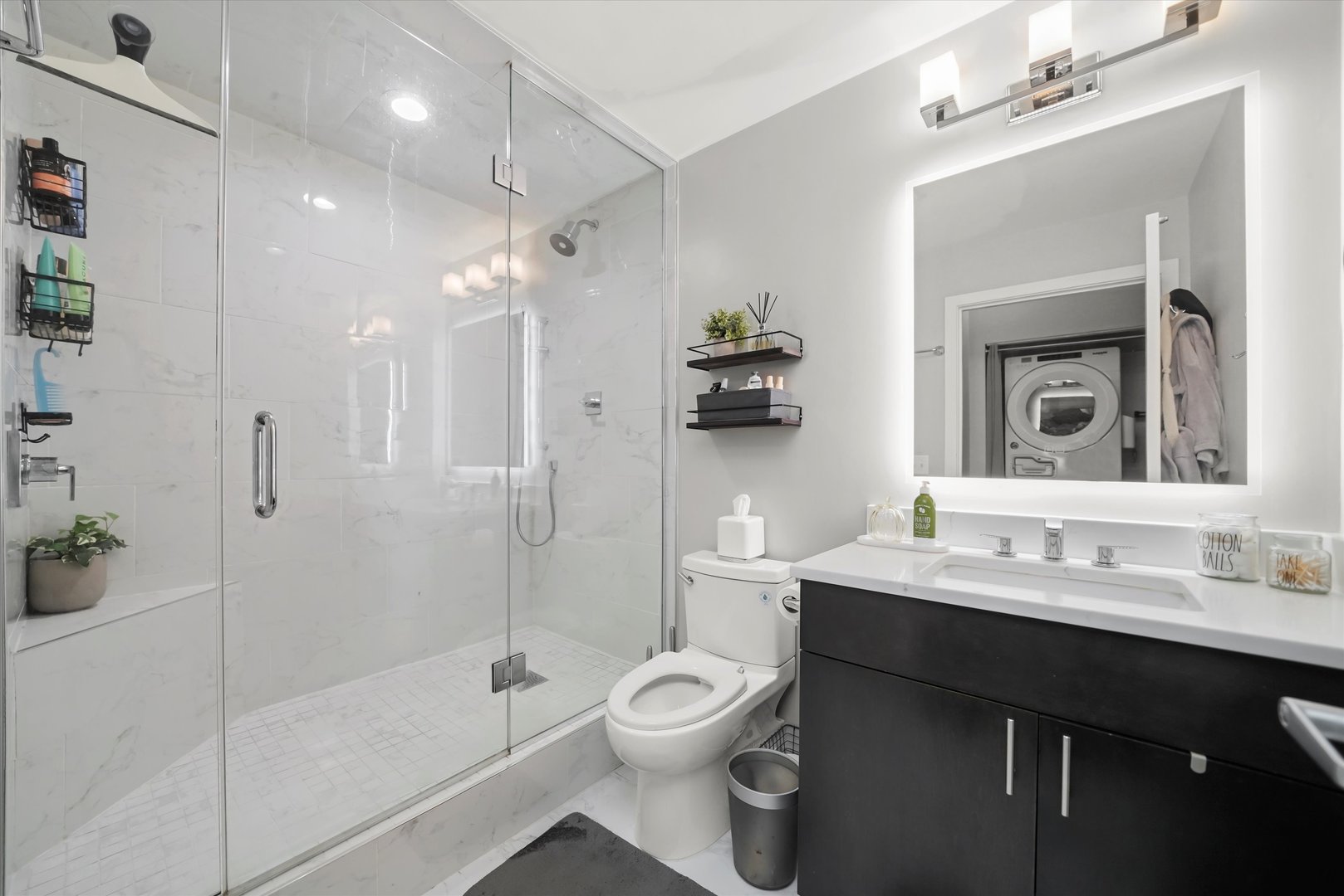 Undisclosed Address Chicago, IL 60607 - Photo 14 of 34 a bathroom with a toilet a sink and a mirror