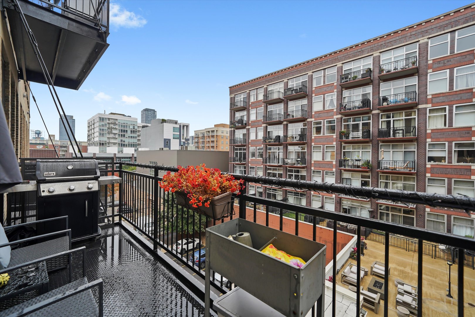 Undisclosed Address Chicago, IL 60607 - Photo 17 of 34 a view of a balcony with wooden chairs