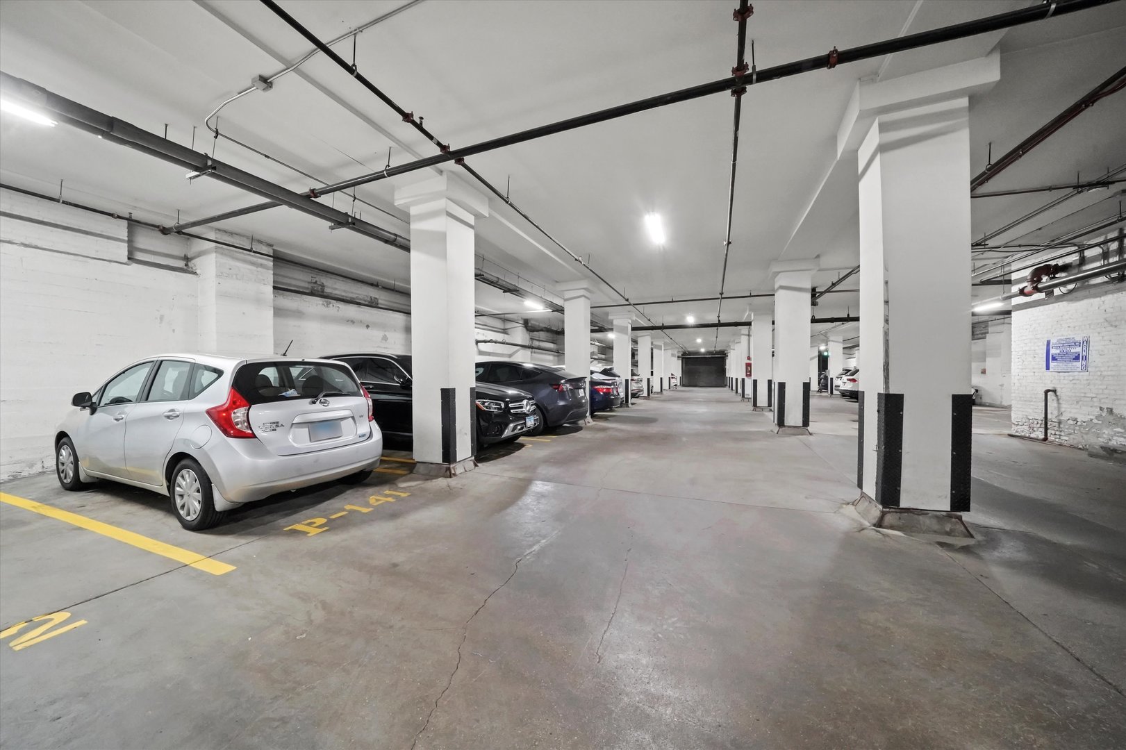 Undisclosed Address Chicago, IL 60607 - Photo 18 of 34 a car parked in a parking garage