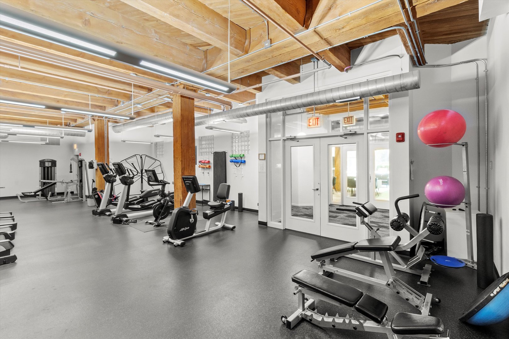 Undisclosed Address Chicago, IL 60607 - Photo 24 of 34 a room with gym equipment