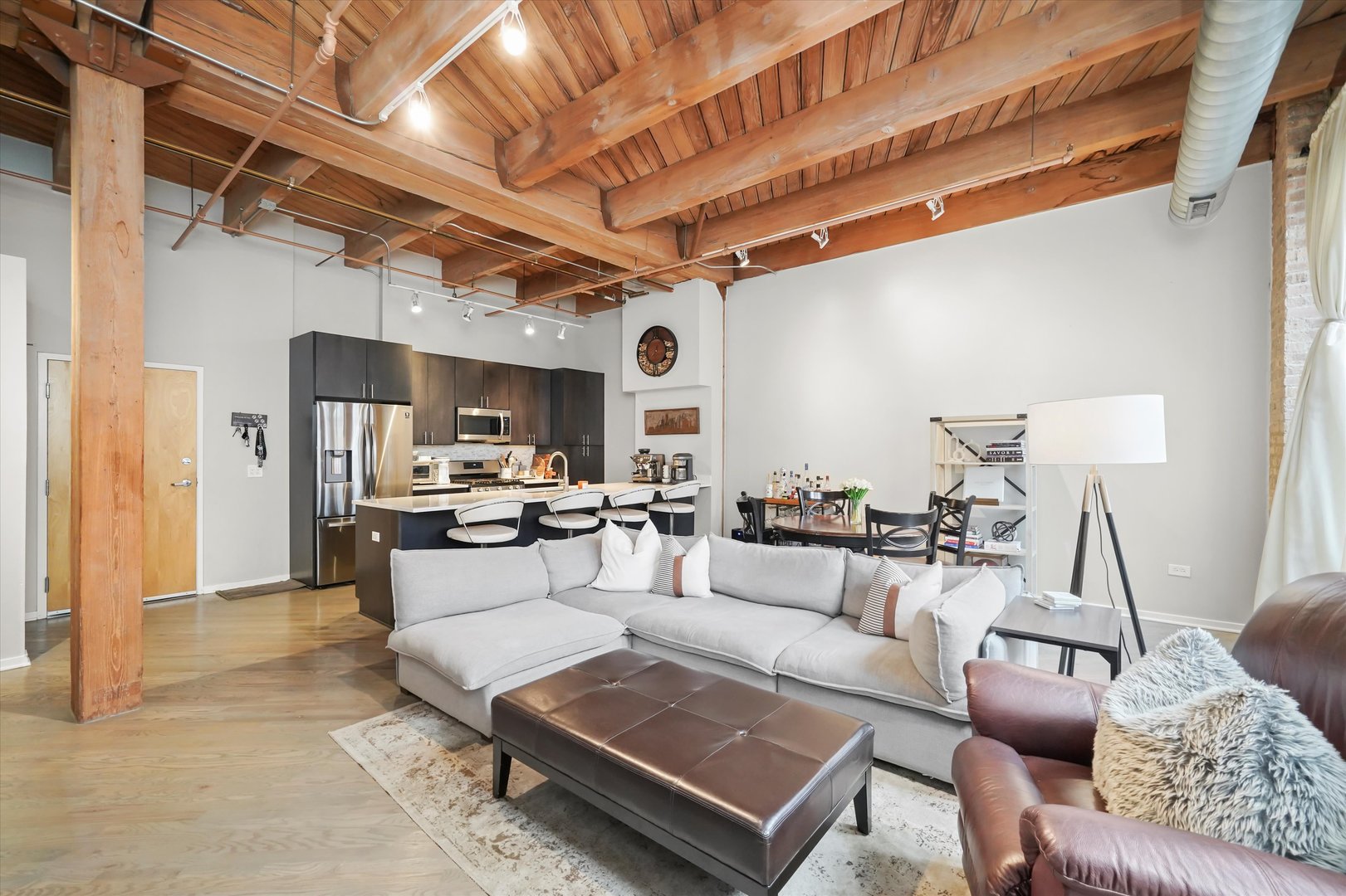 Undisclosed Address Chicago, IL 60607 - Photo 5 of 34 a living room with furniture and a table