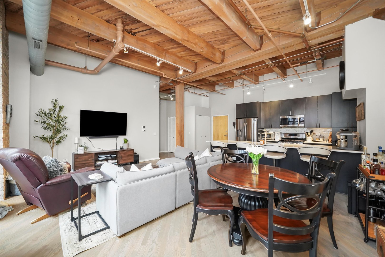 Undisclosed Address Chicago, IL 60607 - Photo 6 of 34 a kitchen with a dining table and chairs
