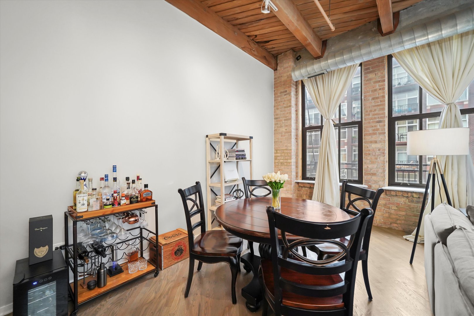 Undisclosed Address Chicago, IL 60607 - Photo 7 of 34 a view of a dining room with furniture and wooden floor