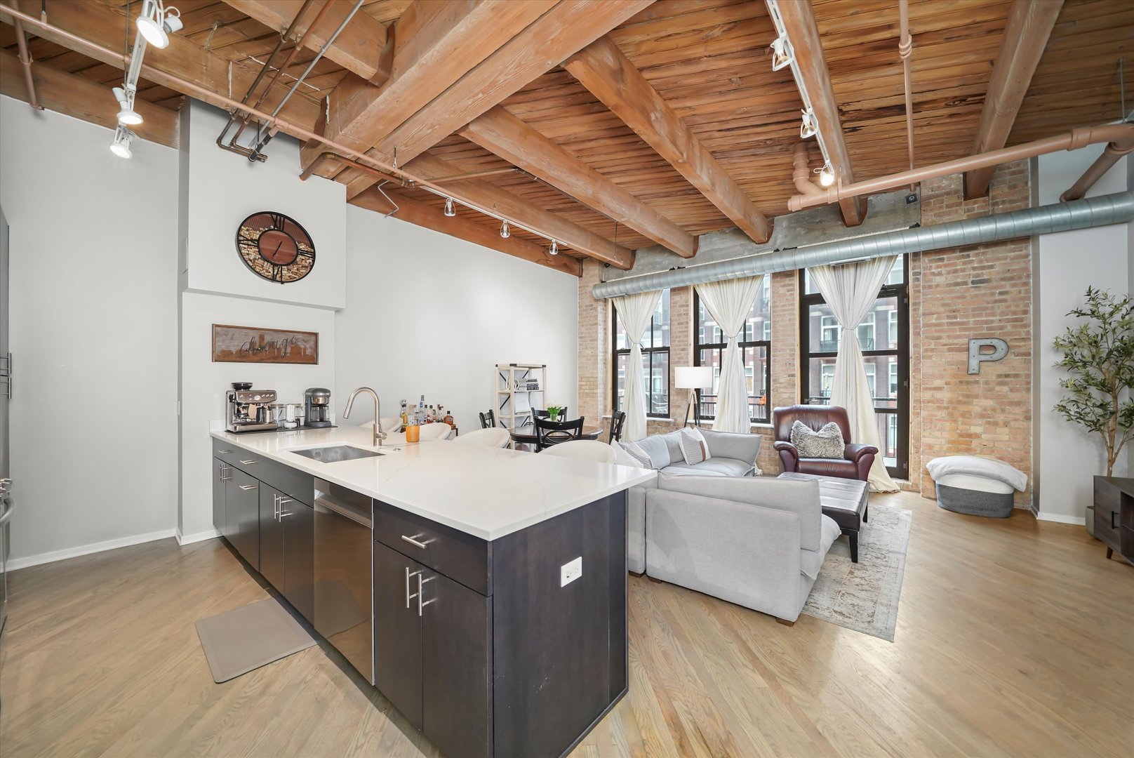 Undisclosed Address Chicago, IL 60607 - Photo 8 of 34 a large white kitchen with a large window