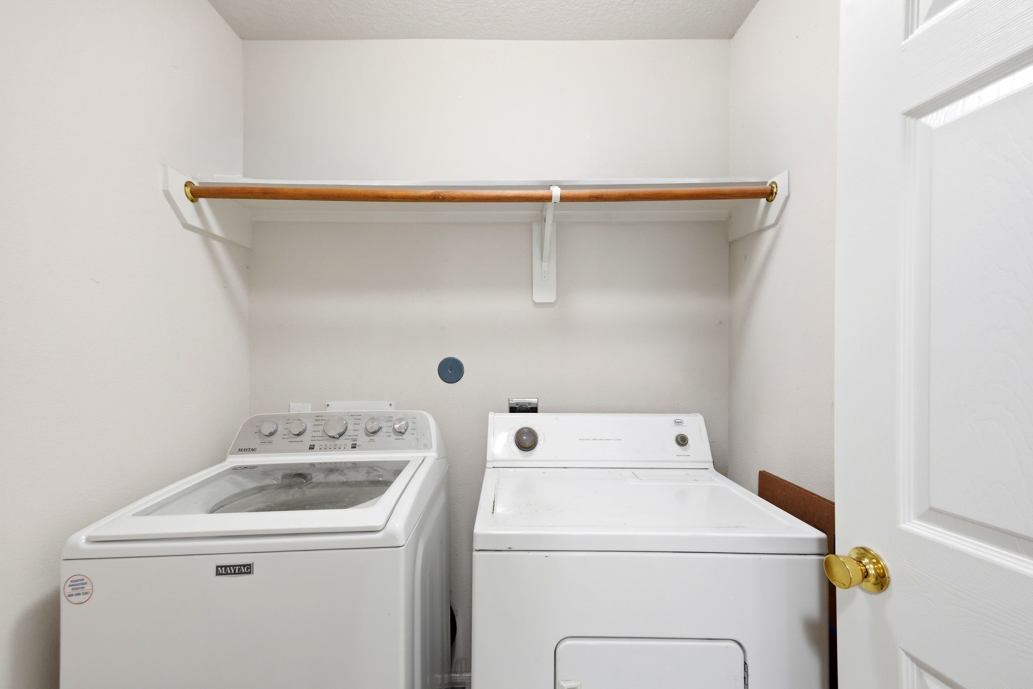 16954 Tableland Trail Conroe, TX 77385 - Photo 29 of 33 Convenient indoor laundry room with built-in shelving for additional storage and organization.