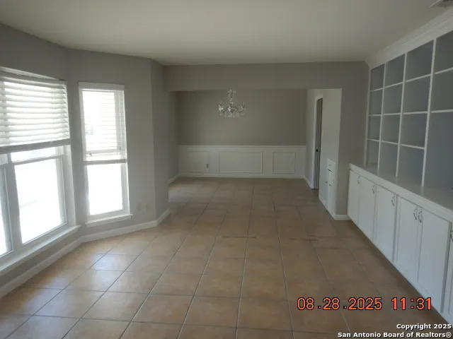 en empty room with windows