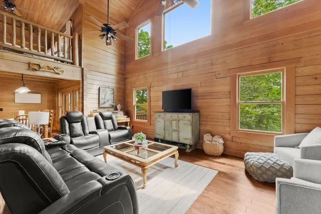 a living room with furniture and a flat screen tv