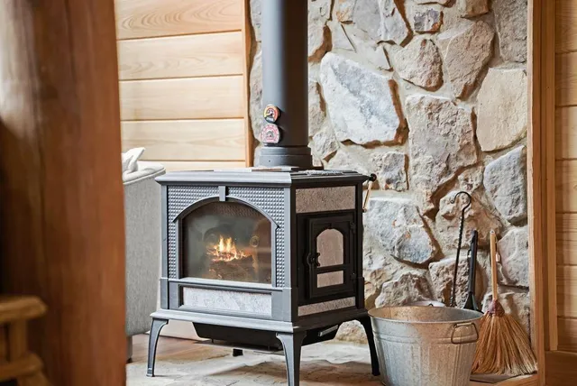 a kitchen with stainless steel appliances granite countertop a stove and a microwave