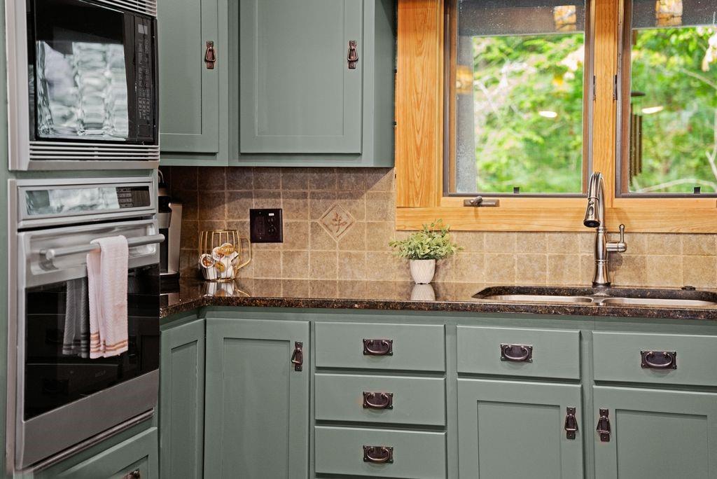 994 Whispering Hill Drive Cherry Log, GA 30522 - Photo 19 of 74 a kitchen with a sink and cabinets