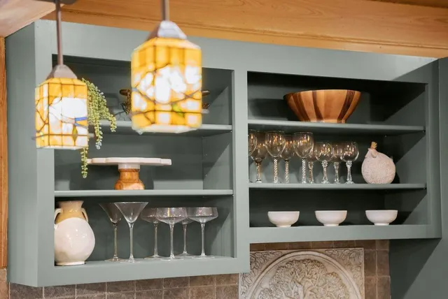 a dining room with furniture a chandelier and wooden floor