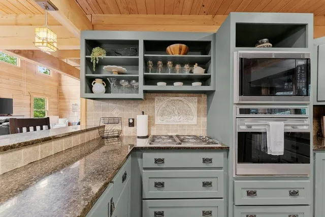 a view of a balcony with furniture and wooden floor
