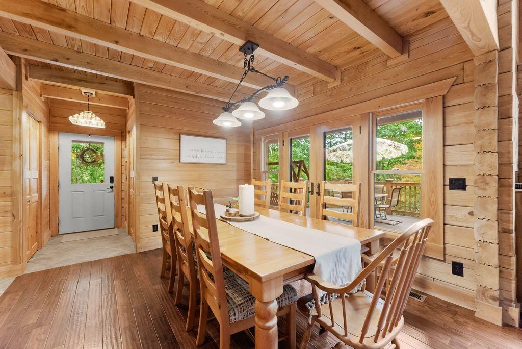 994 Whispering Hill Drive Cherry Log, GA 30522 - Photo 26 of 74 a dining room with furniture a chandelier and wooden floor