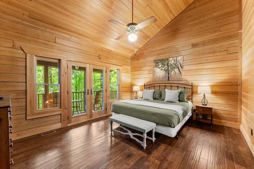 994 Whispering Hill Drive Cherry Log, GA 30522 - Photo 31 of 74 a bedroom with a bed and a large window with outer view