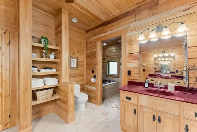 a bedroom with a bed and a night stand