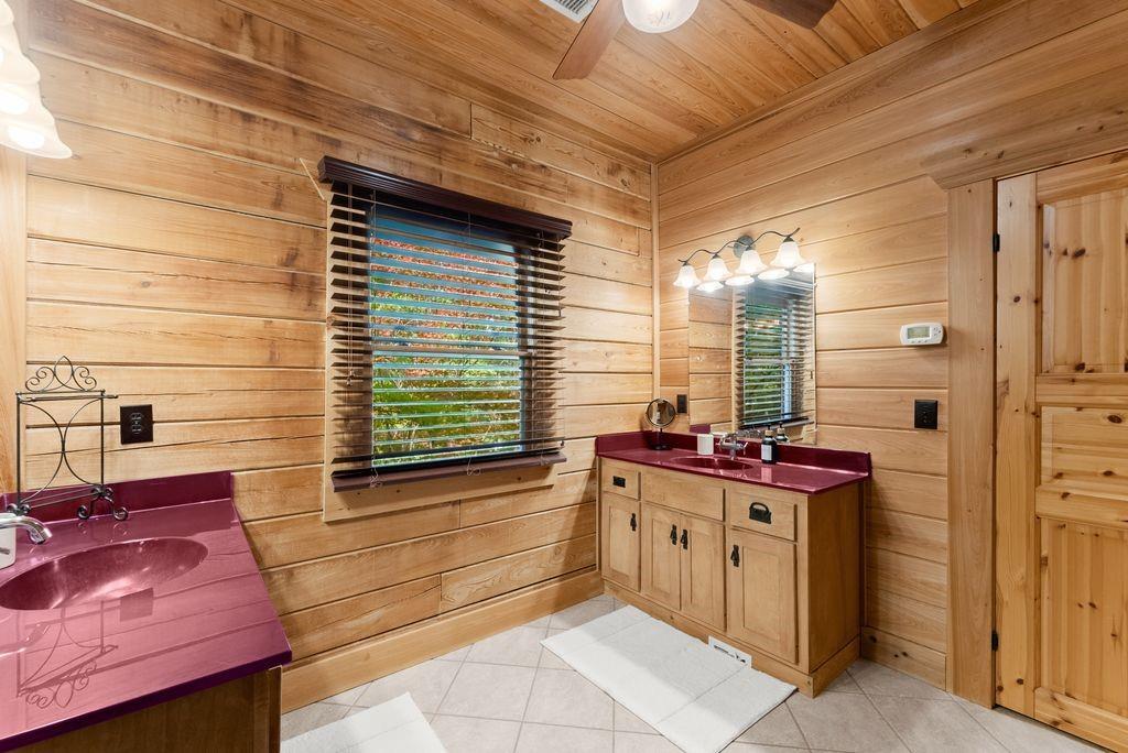 994 Whispering Hill Drive Cherry Log, GA 30522 - Photo 36 of 74 a bathroom with a sink and a mirror