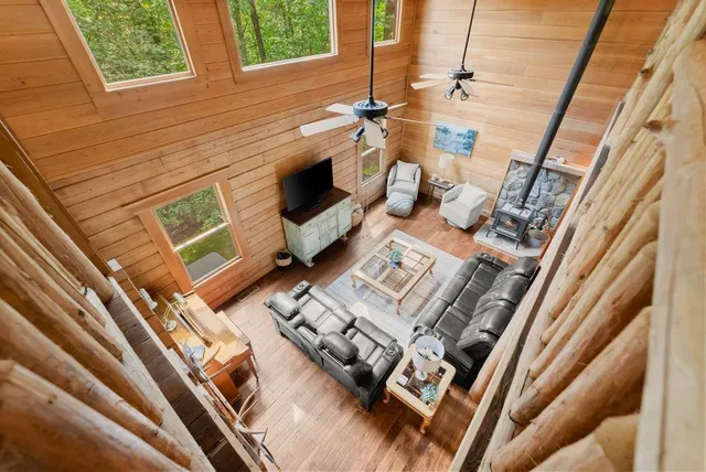 a view of a backyard with table and chairs and potted plants