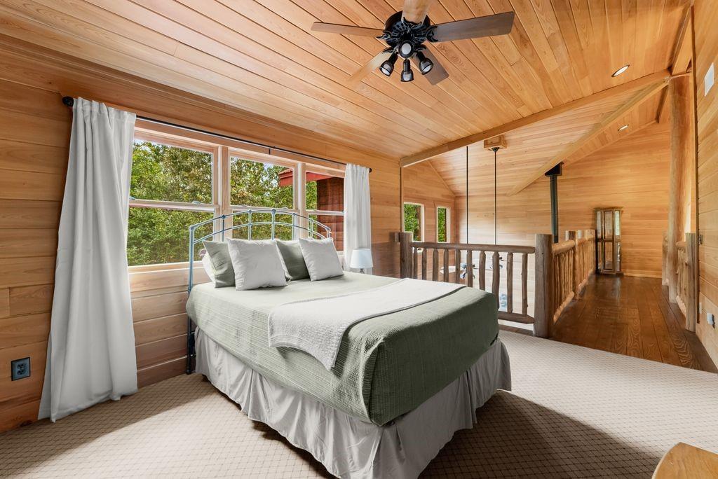 994 Whispering Hill Drive Cherry Log, GA 30522 - Photo 46 of 74 a bedroom with a bed and a large window