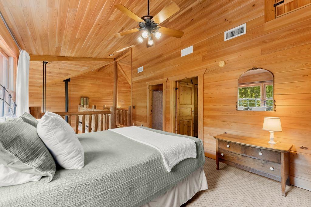 994 Whispering Hill Drive Cherry Log, GA 30522 - Photo 47 of 74 a bedroom with a bed and a night stand