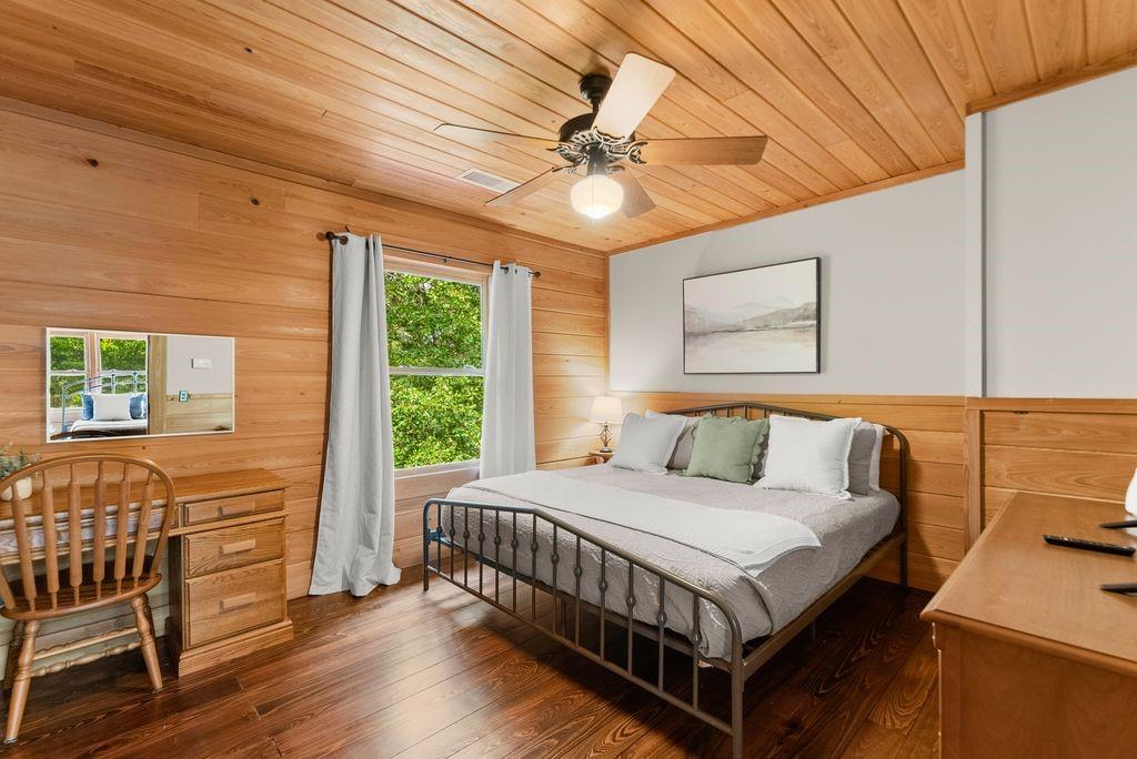 994 Whispering Hill Drive Cherry Log, GA 30522 - Photo 52 of 74 a bedroom with a bed and a chandelier