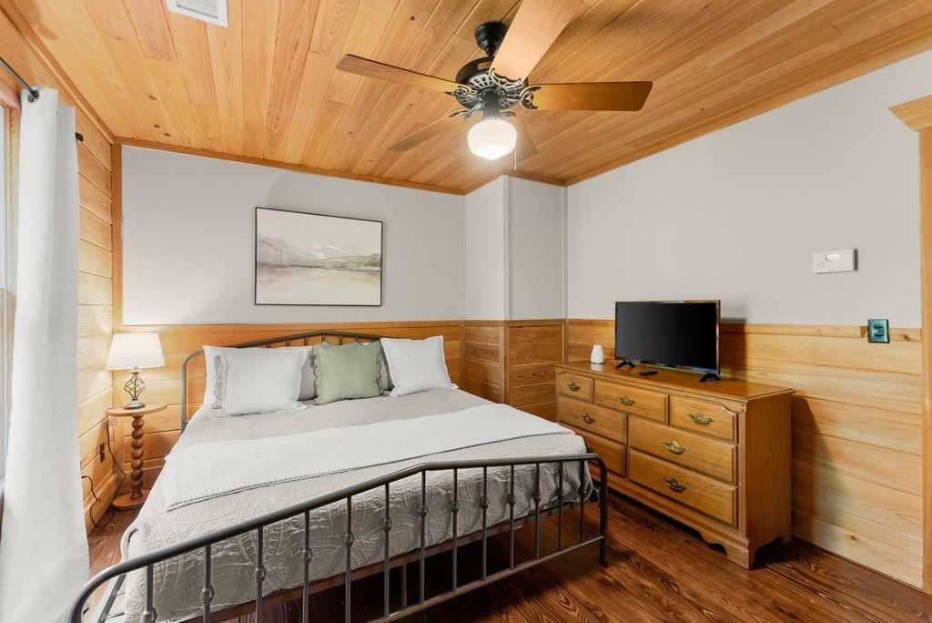 994 Whispering Hill Drive Cherry Log, GA 30522 - Photo 53 of 74 a bedroom with a bed and a flat screen tv