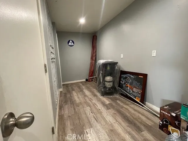 a room with furniture and a wooden floor