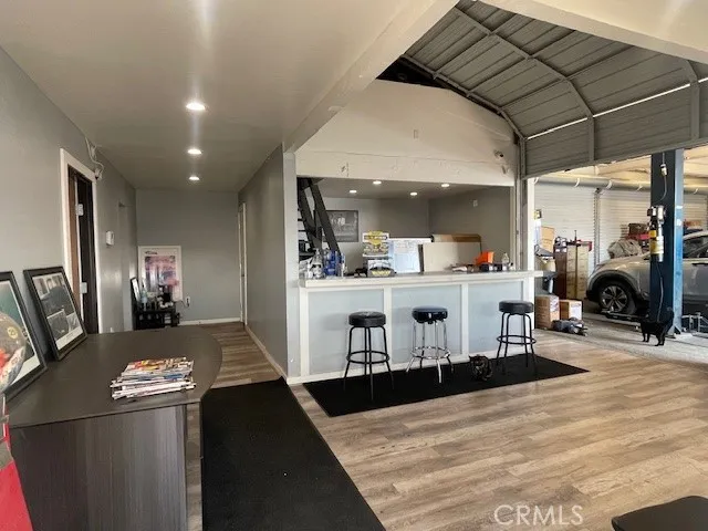 a living room with fireplace furniture and a table