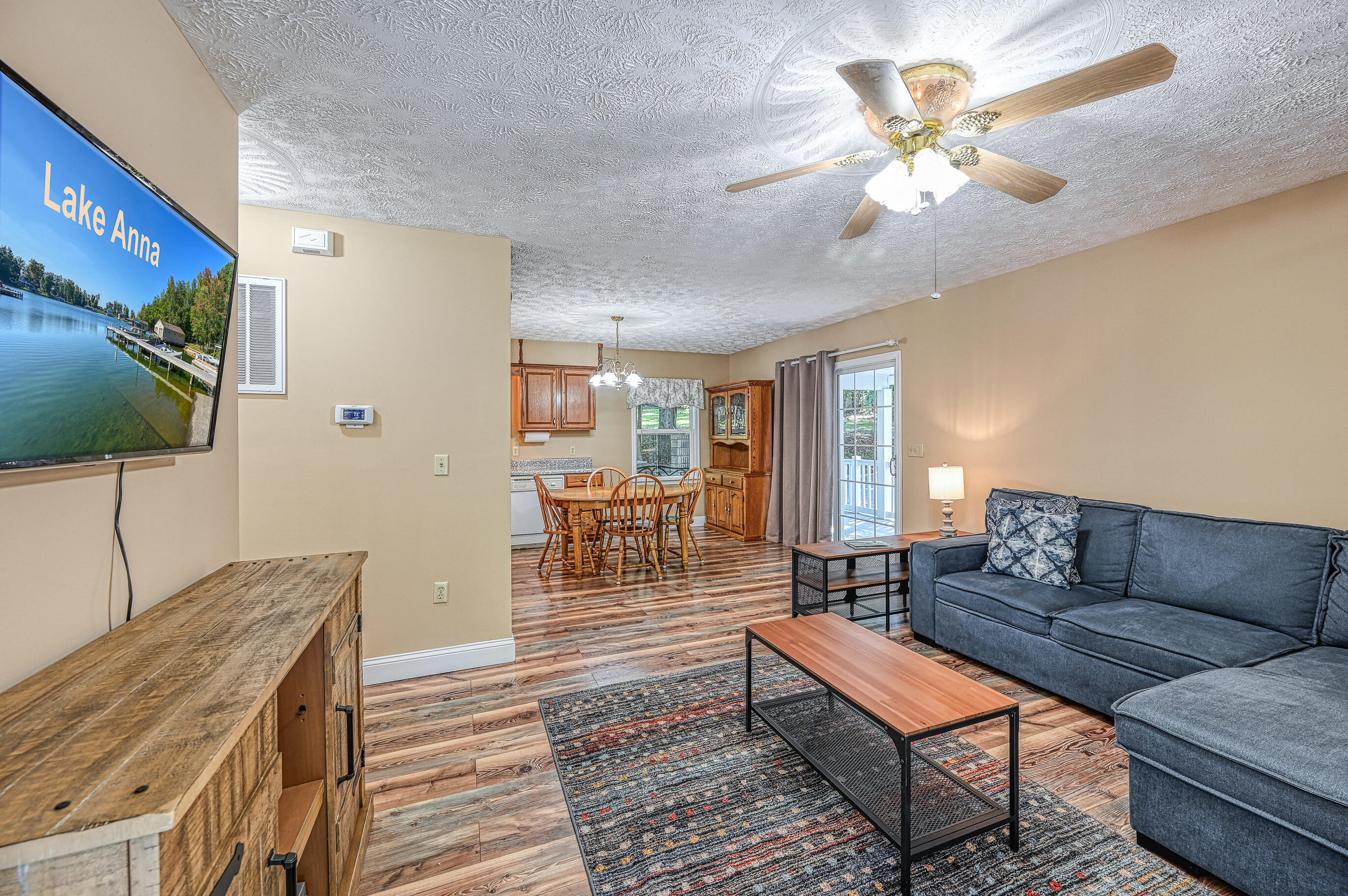 206 Oak Road Bumpass, VA 23024 - Photo 11 of 38 a living room with furniture and a flat screen tv