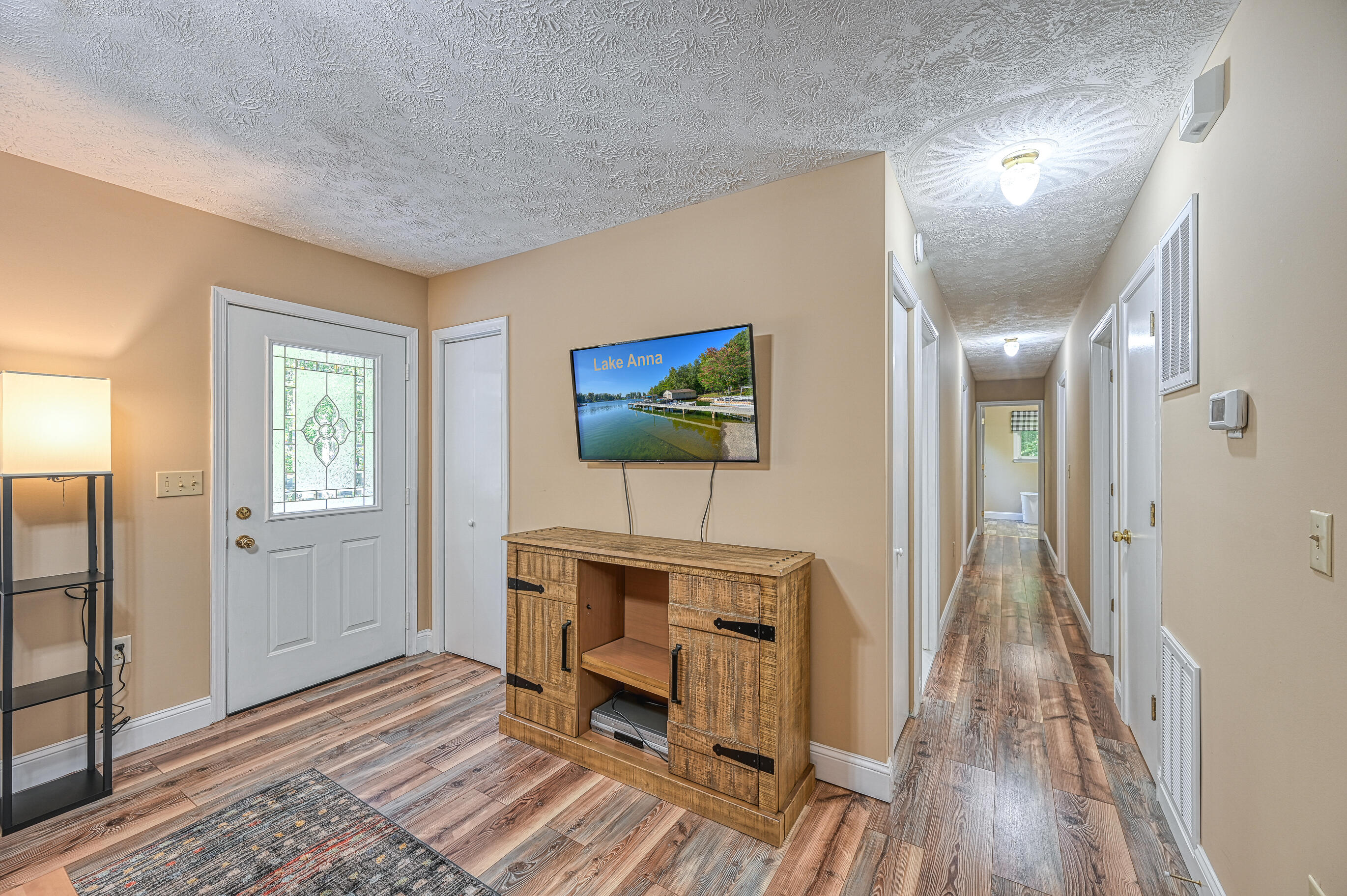 206 Oak Road Bumpass, VA 23024 - Photo 13 of 38 a view of a livingroom with furniture wooden floor and window