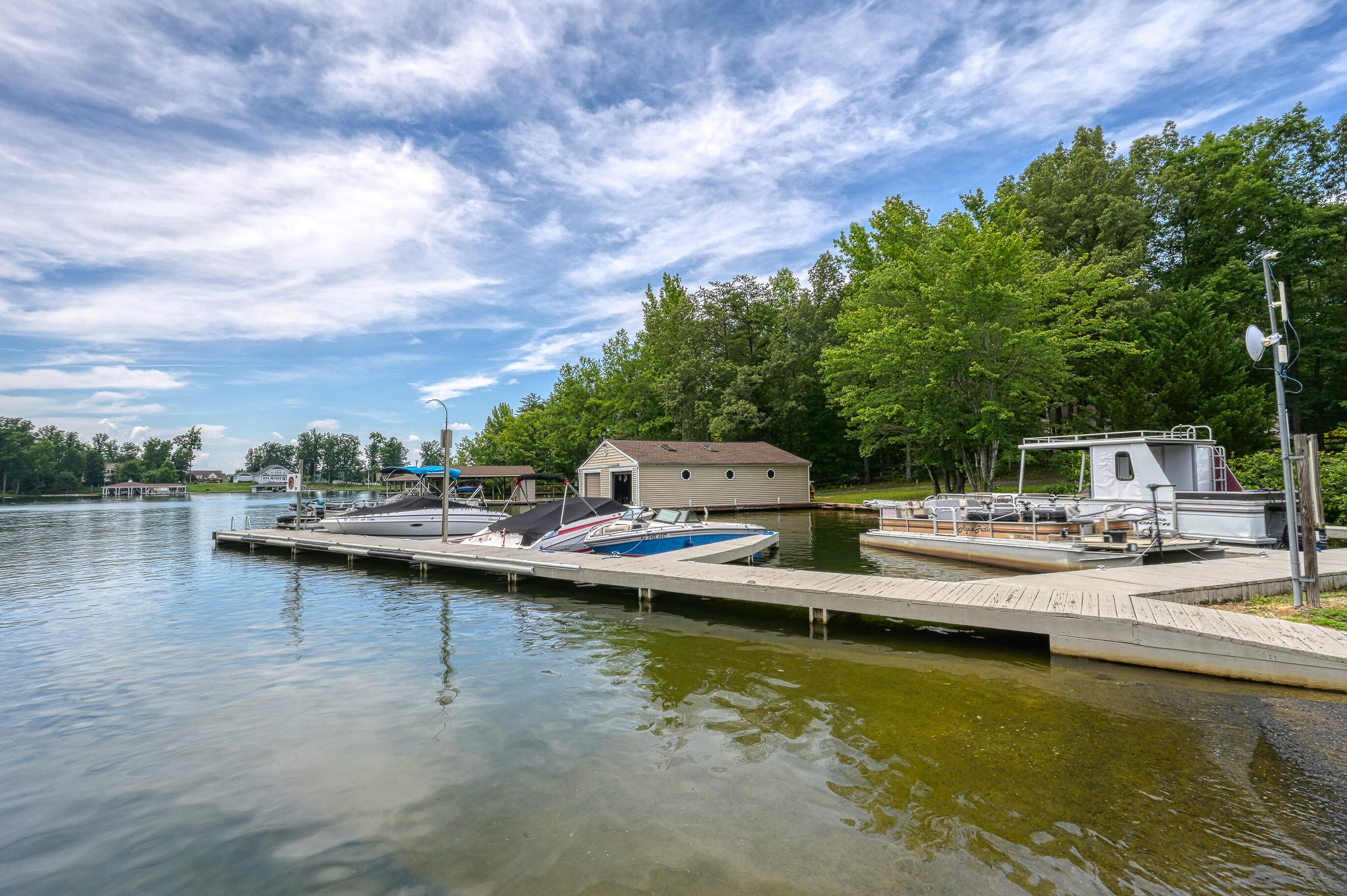 206 Oak Road Bumpass, VA 23024 - Photo 30 of 38 a view of a lake with boats and trees