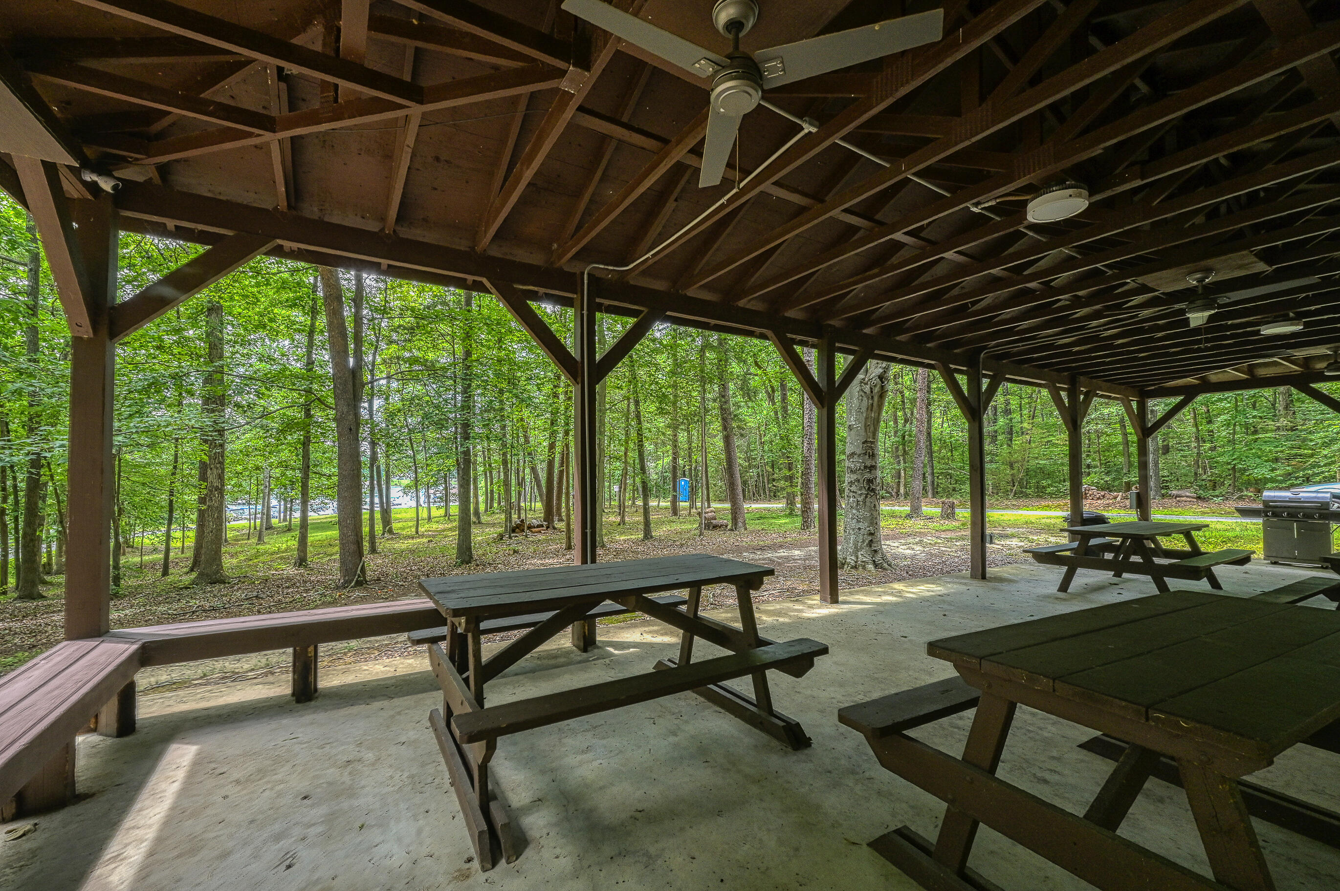 206 Oak Road Bumpass, VA 23024 - Photo 32 of 38 a living room with patio furniture and a garden