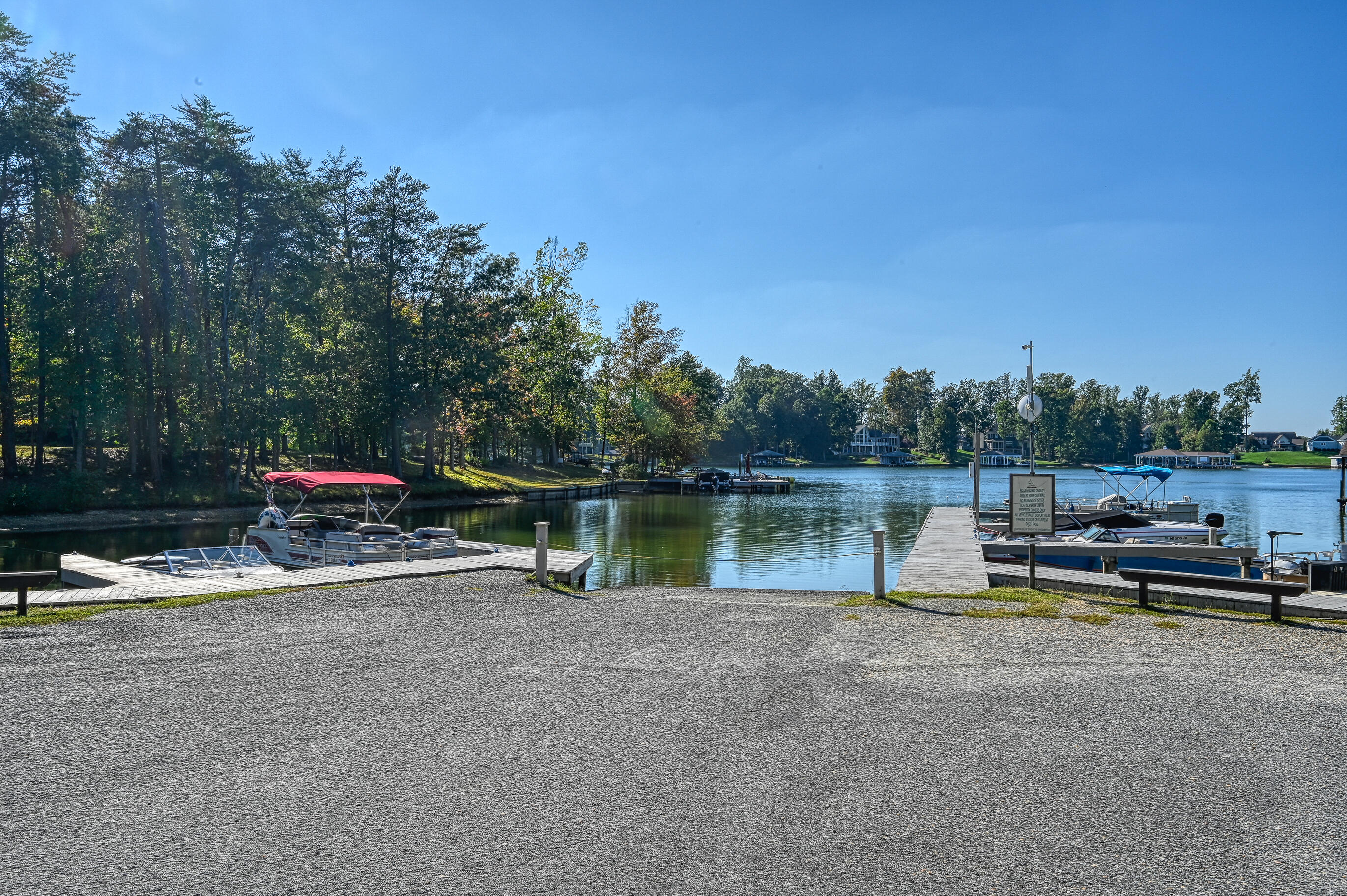 206 Oak Road Bumpass, VA 23024 - Photo 34 of 38 a blue swimming pool with lake view