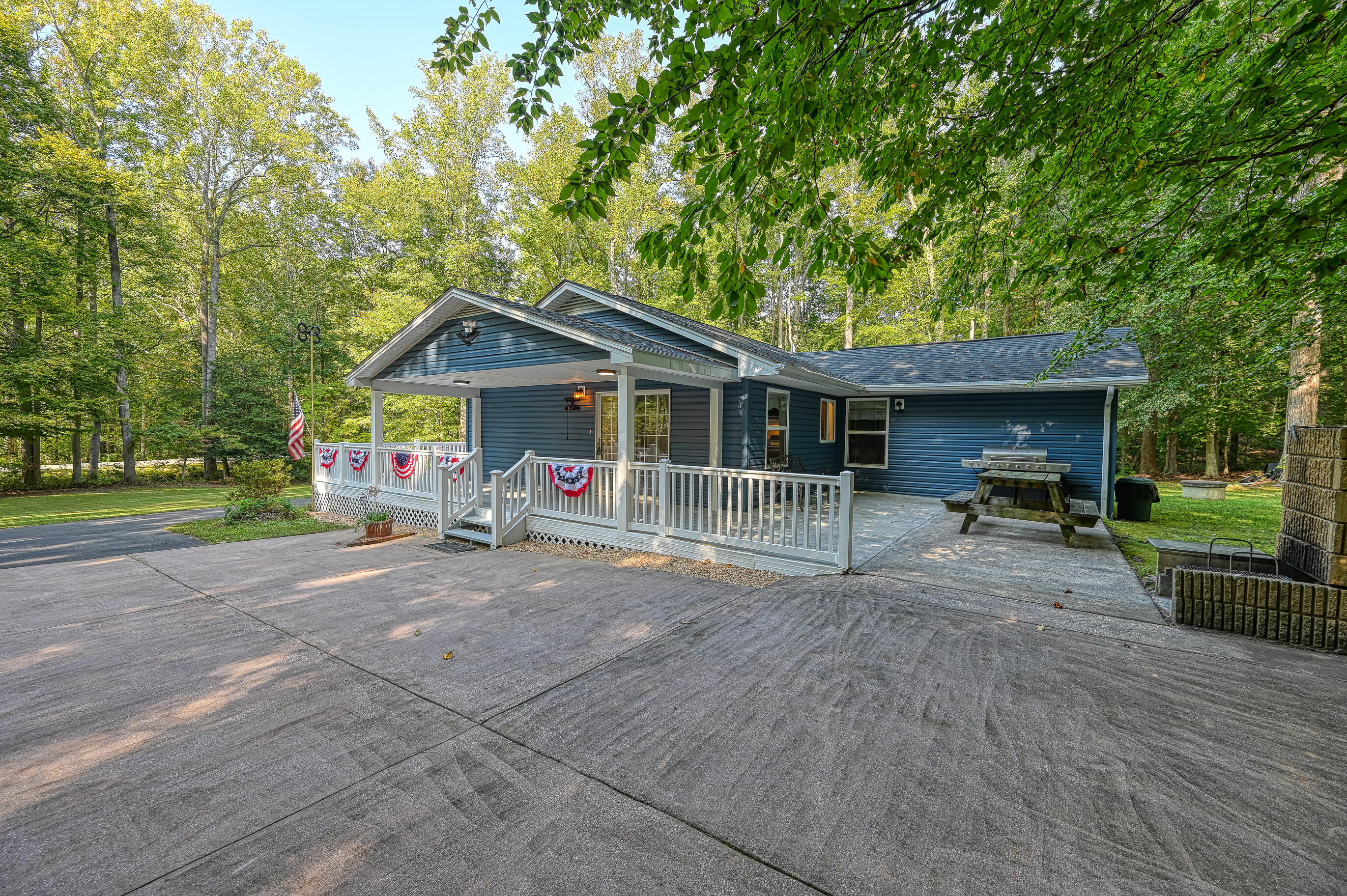 206 Oak Road Bumpass, VA 23024 - Photo 7 of 38 a front view of a house with a yard and porch