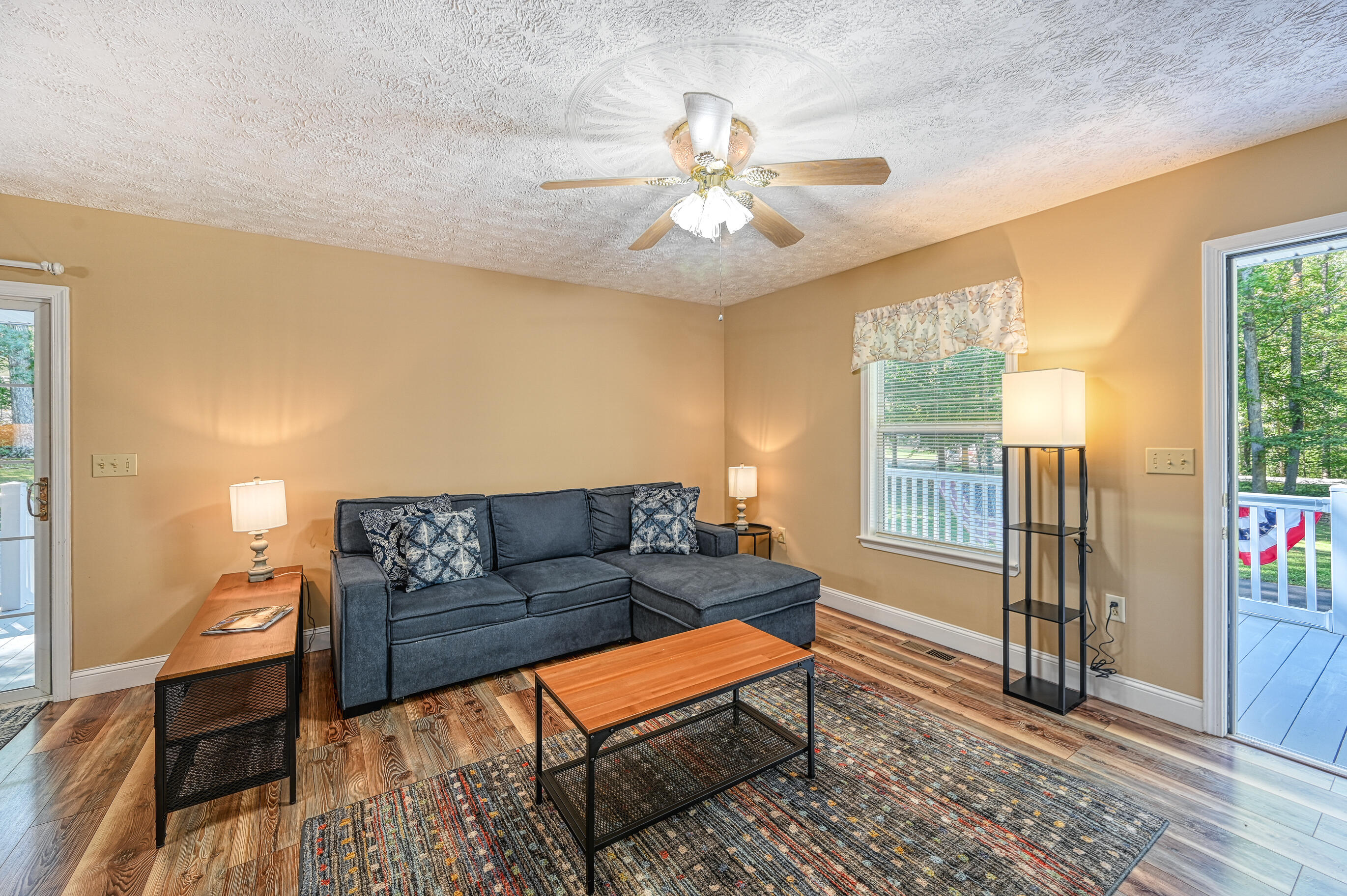 206 Oak Road Bumpass, VA 23024 - Photo 9 of 38 a living room with furniture and a chandelier