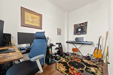 a bedroom with a workspace