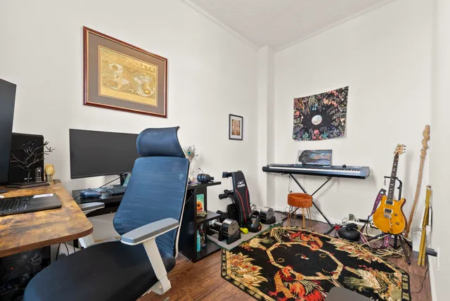 a bedroom with a workspace