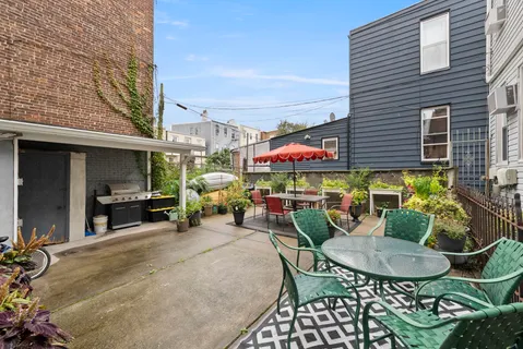 a view of a chairs and table in patio