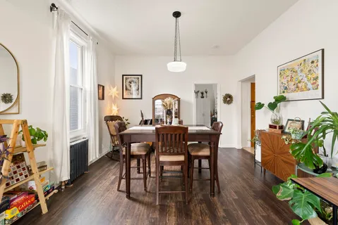 a view of a dining room with furniture window and wooden floor
