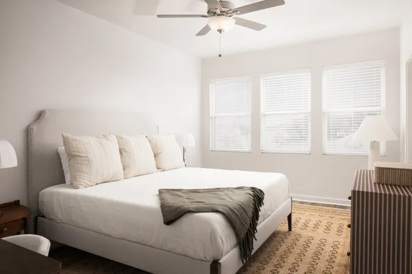 a bed room with a bed and a window